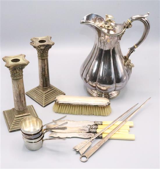 Plated claret jug, candlesticks and cutlery